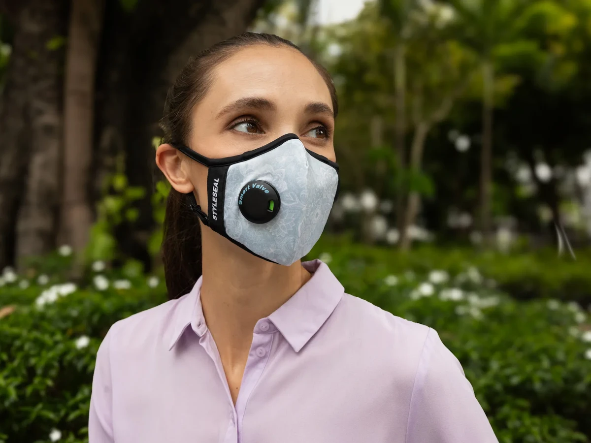 couple wearing penumbr and umbra pro masks in safety orange